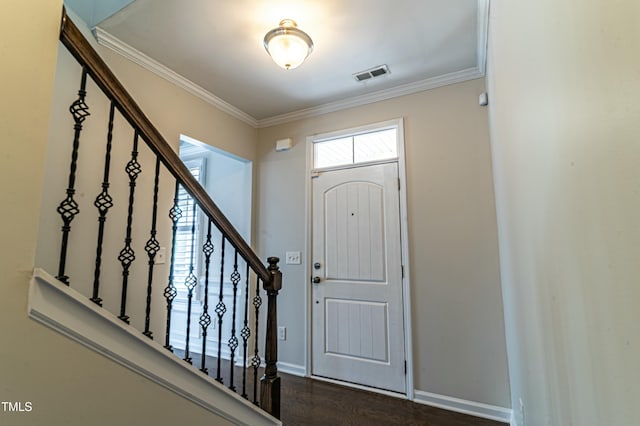 foyer entrance featuring dark hardwood / wood-style floors and ornamental molding