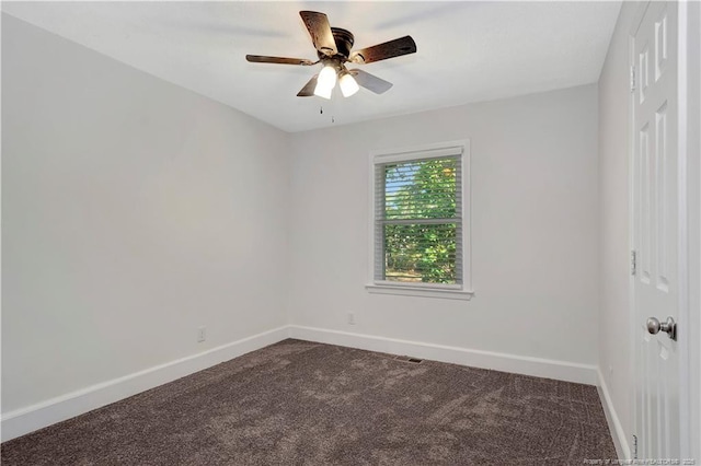 spare room featuring carpet flooring and ceiling fan