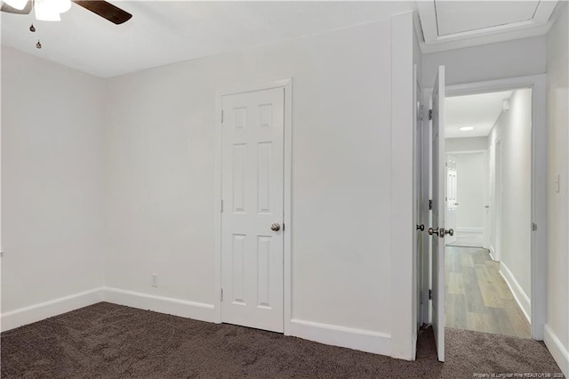 unfurnished bedroom featuring carpet and ceiling fan