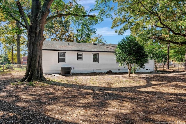 back of property with central AC unit