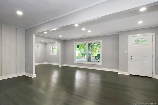 interior space with dark hardwood / wood-style flooring, an inviting chandelier, and crown molding