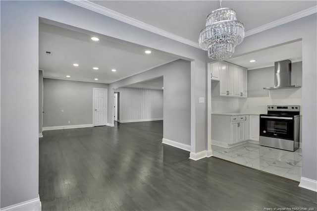 kitchen featuring wall chimney exhaust hood, an inviting chandelier, stainless steel electric stove, white cabinets, and ornamental molding