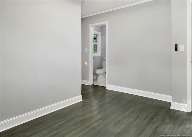 unfurnished room featuring dark wood-type flooring