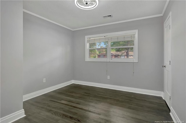 empty room with crown molding and dark hardwood / wood-style floors