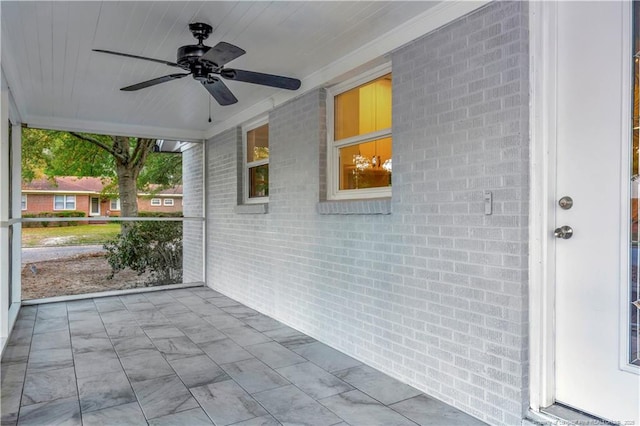 view of patio featuring ceiling fan