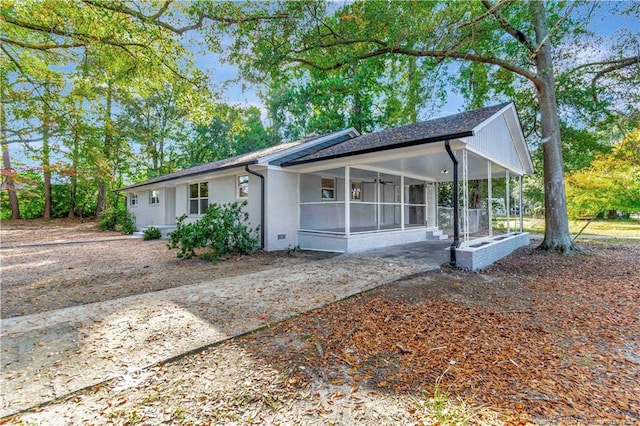 view of front of property with a sunroom