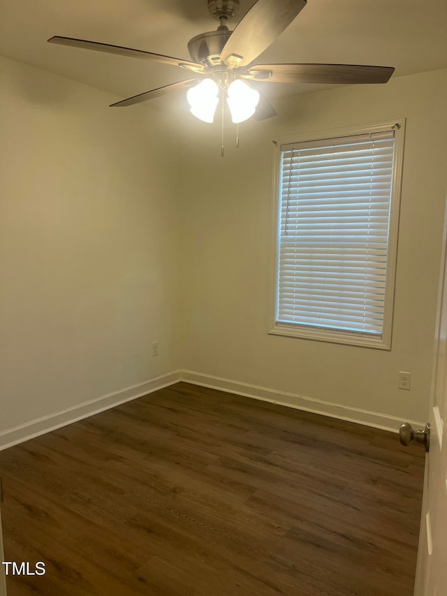 spare room featuring ceiling fan and dark hardwood / wood-style flooring