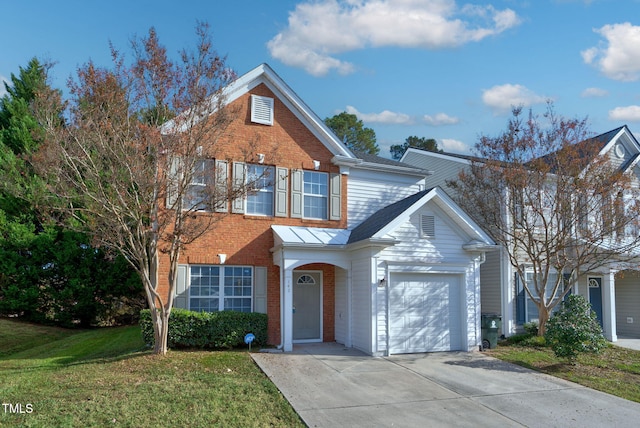 view of front of house with a garage and a front yard