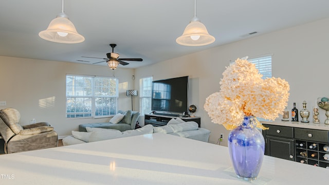 bedroom featuring multiple windows and ceiling fan