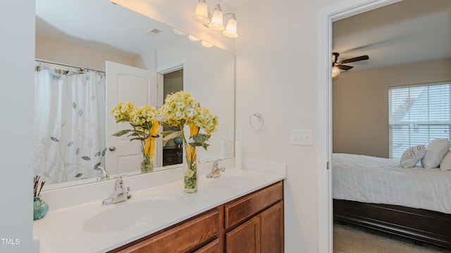 bathroom featuring vanity, ceiling fan, and walk in shower