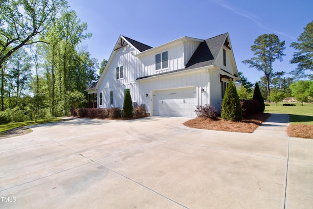 view of property exterior with a garage and a yard