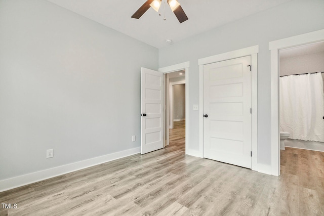 unfurnished bedroom featuring ceiling fan and light hardwood / wood-style flooring