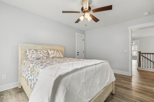 bedroom featuring hardwood / wood-style flooring and ceiling fan