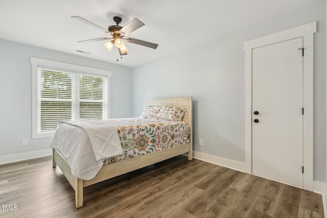 bedroom featuring hardwood / wood-style flooring and ceiling fan