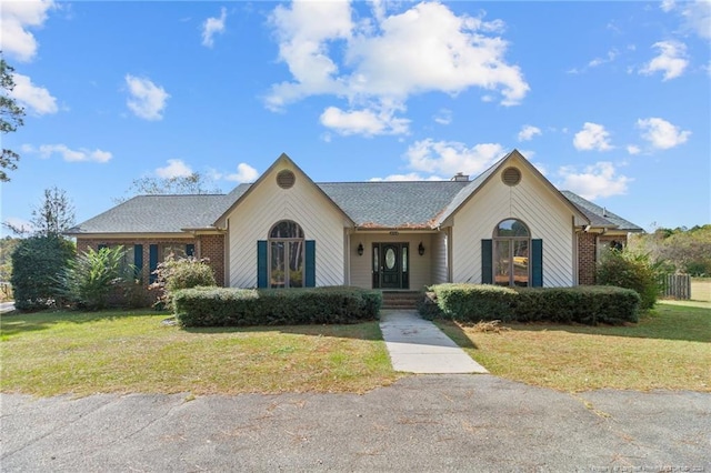 ranch-style home with a front yard