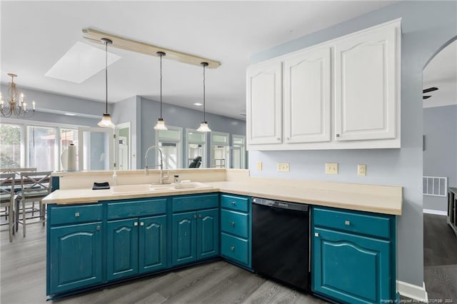 kitchen with dishwasher, hanging light fixtures, wood-type flooring, kitchen peninsula, and sink