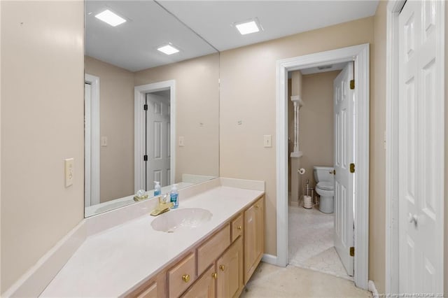 bathroom featuring vanity, toilet, and tile patterned floors