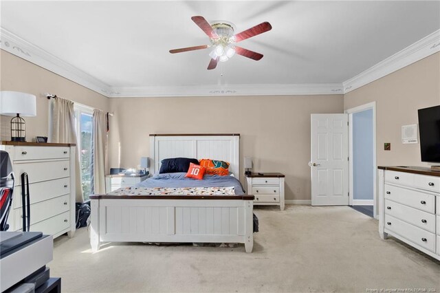 bedroom with crown molding, light colored carpet, and ceiling fan