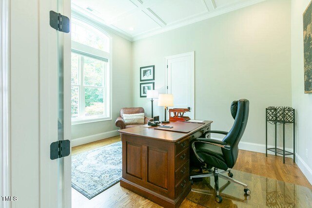 office area featuring light hardwood / wood-style floors, coffered ceiling, and crown molding