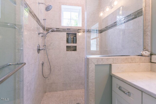 bathroom with vanity and an enclosed shower