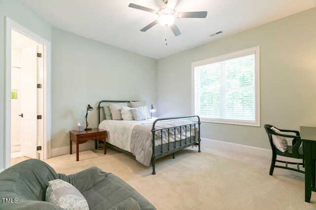 bedroom with light carpet and ceiling fan