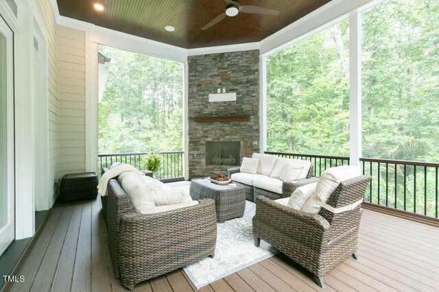 deck featuring outdoor lounge area and ceiling fan