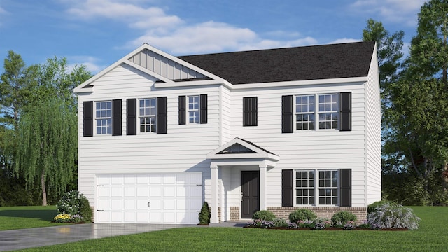 view of front of house featuring a front yard and a garage