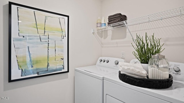 washroom featuring washer and clothes dryer