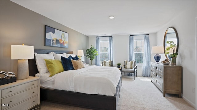 bedroom featuring light carpet