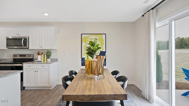 dining area with light hardwood / wood-style floors