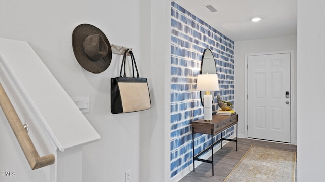 foyer entrance featuring wood-type flooring