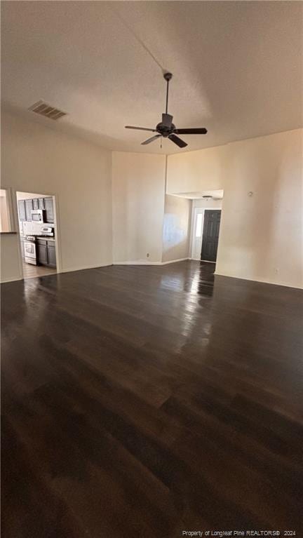 empty room featuring dark hardwood / wood-style floors and ceiling fan