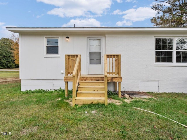 rear view of property with a lawn