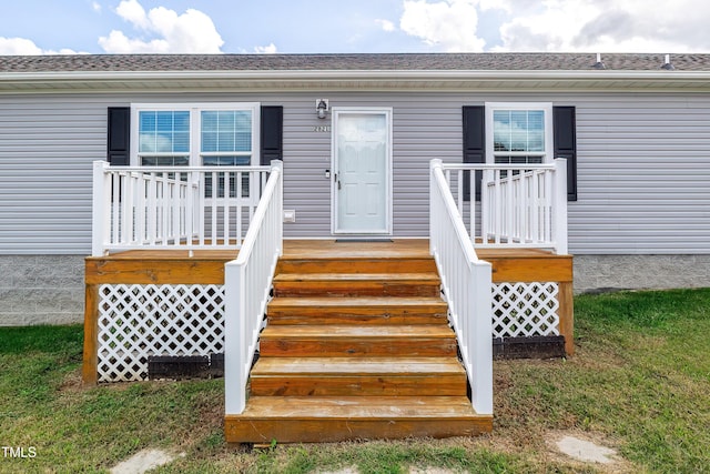 entrance to property featuring a deck