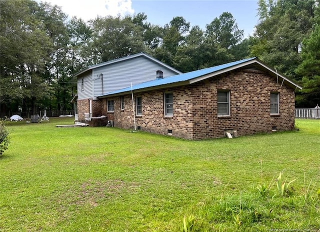 view of home's exterior featuring a lawn