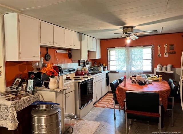 kitchen featuring white cabinetry, electric stove, and ceiling fan