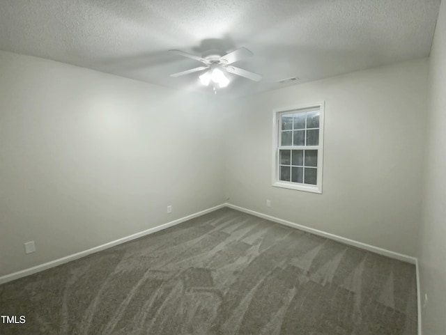 carpeted empty room with a textured ceiling and ceiling fan