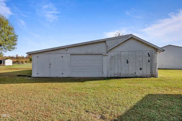 garage featuring a yard