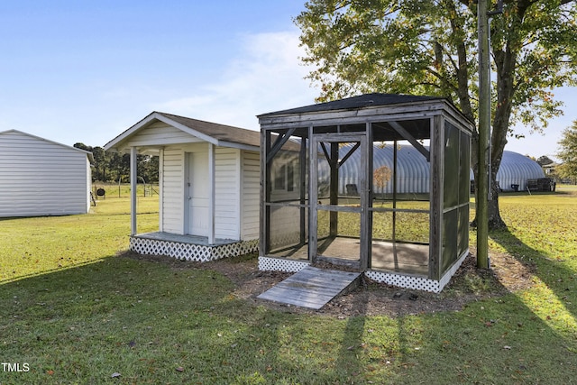 2494 Joel Johnson Rd, Lillington, NC 27546 - view of outdoor structure with a sunroom