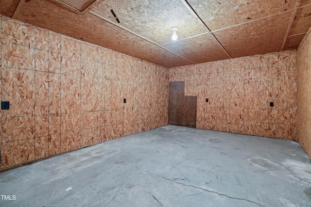 empty room with concrete flooring