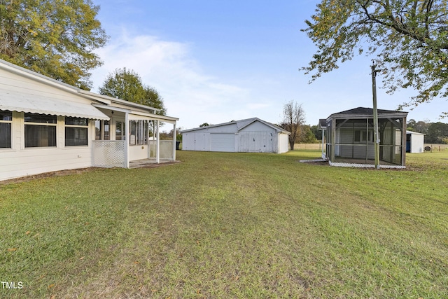 2494 Joel Johnson Rd, Lillington, NC 27546 - view of green lawn featuring a sunroom and an outdoor structure