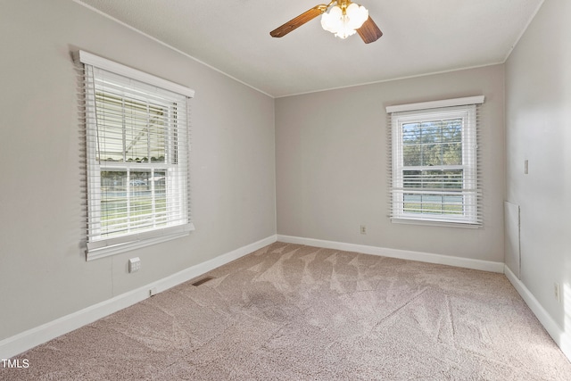 carpeted empty room with ceiling fan