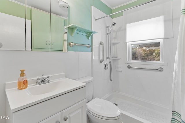 bathroom featuring ornamental molding, curtained shower, vanity, and toilet