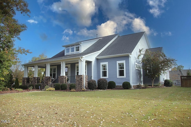 view of front of house with a porch and a front lawn