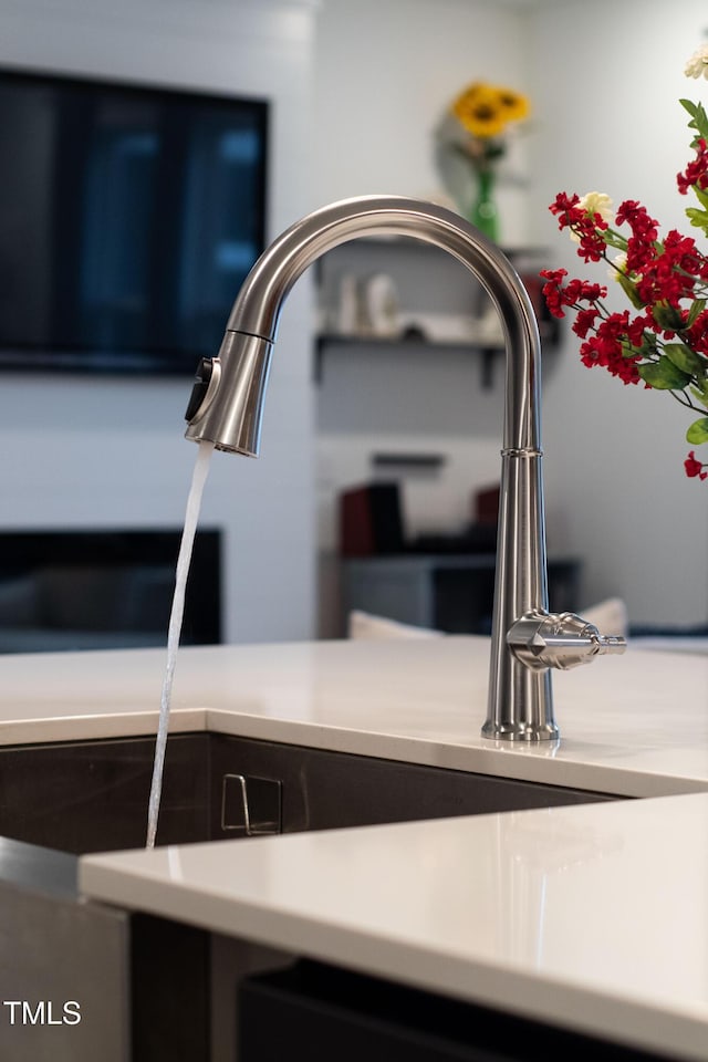 kitchen view of light countertops and a sink