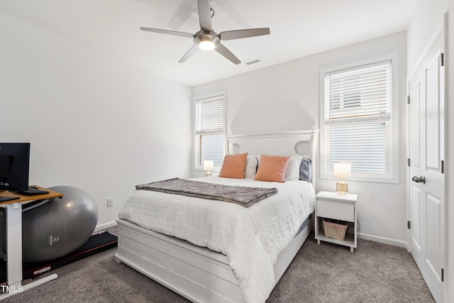 bedroom with carpet flooring, baseboards, and a ceiling fan
