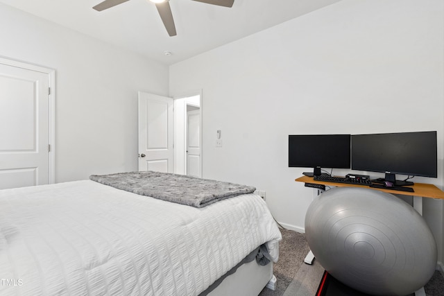 bedroom with carpet flooring, a ceiling fan, baseboards, and an office area