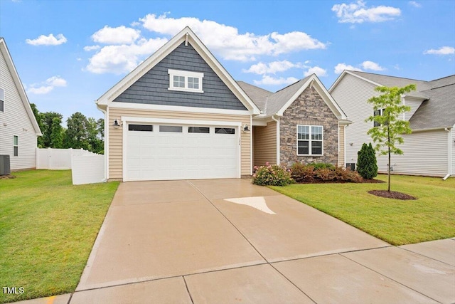 craftsman house featuring concrete driveway, stone siding, and central AC