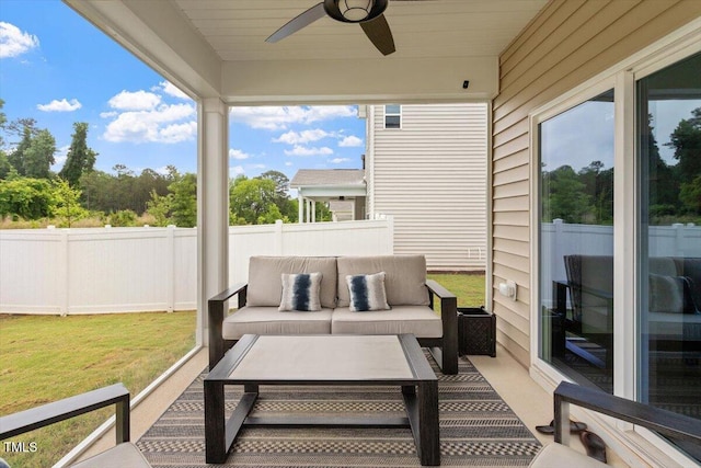 sunroom / solarium with a ceiling fan and outdoor lounge area