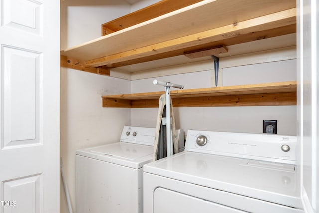 laundry room featuring washing machine and clothes dryer